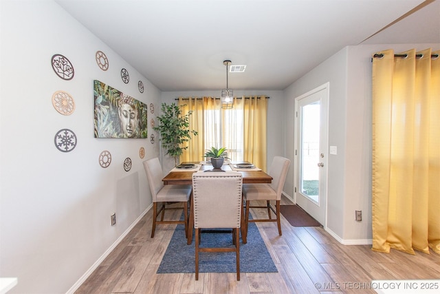 dining room featuring wood-type flooring