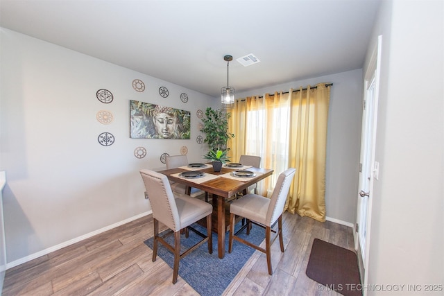 dining room with hardwood / wood-style floors