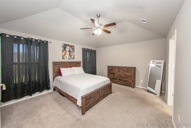 bedroom featuring ceiling fan, light colored carpet, and lofted ceiling