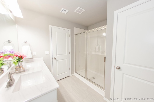 bathroom with vanity and walk in shower