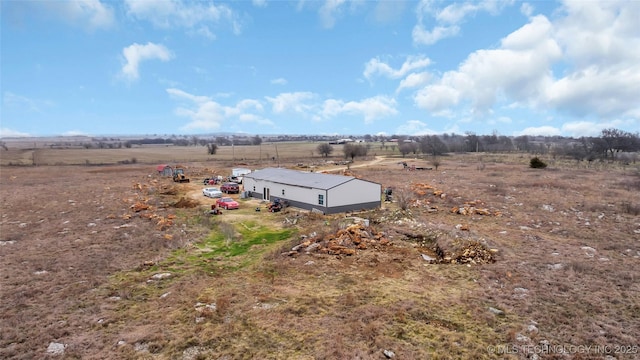 birds eye view of property with a rural view