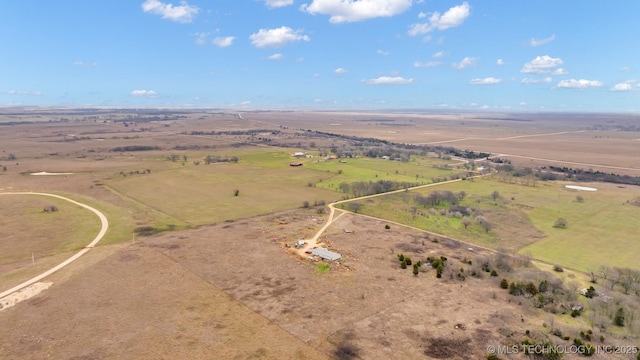 birds eye view of property with a rural view