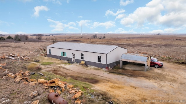 birds eye view of property featuring a rural view