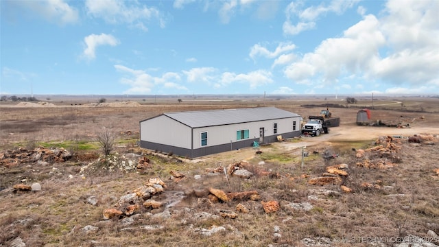 view of property exterior featuring a rural view