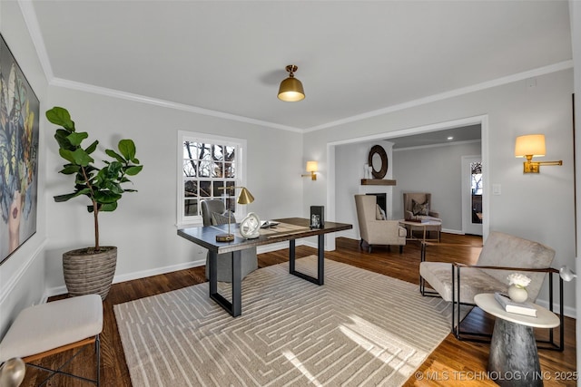 home office with crown molding, baseboards, and wood finished floors