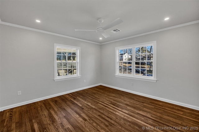 unfurnished room with baseboards, visible vents, dark wood-style flooring, and crown molding