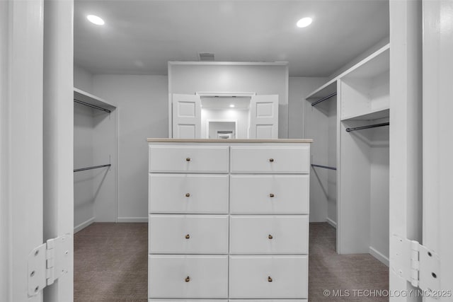 walk in closet featuring carpet flooring and visible vents