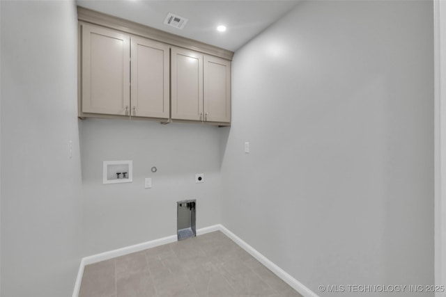 clothes washing area featuring hookup for a washing machine, hookup for a gas dryer, cabinet space, electric dryer hookup, and baseboards