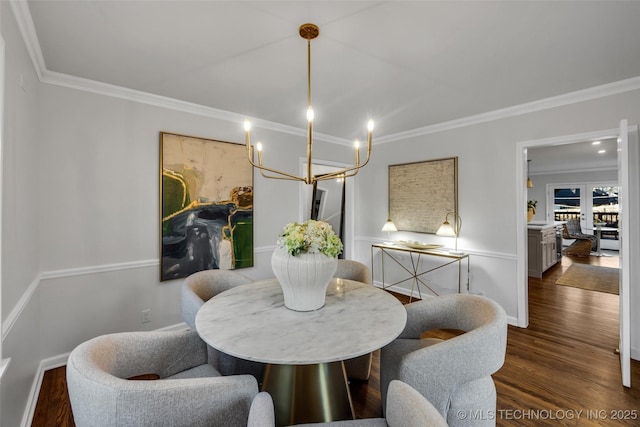 dining area with crown molding and dark wood finished floors