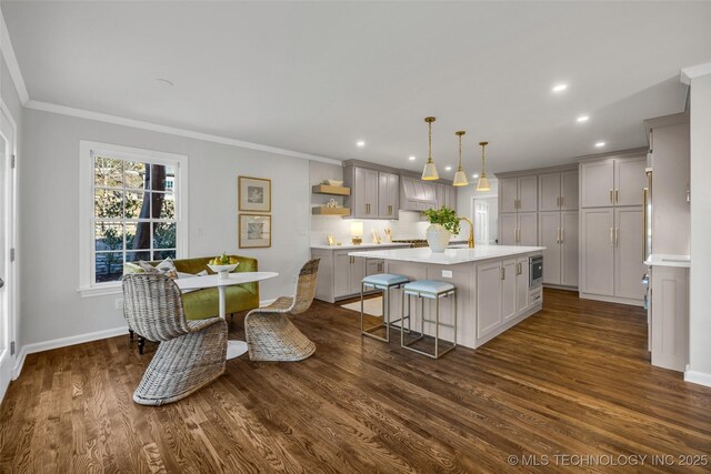 kitchen with light countertops, crown molding, gray cabinetry, and open shelves