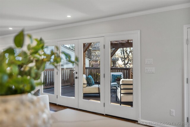 entryway featuring recessed lighting, ornamental molding, and french doors