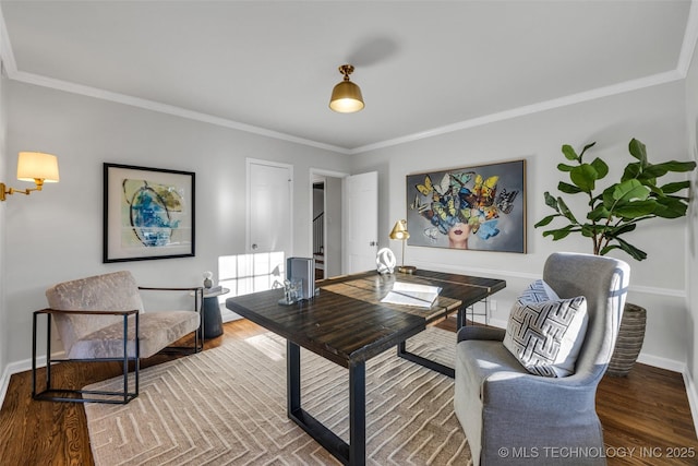 office area featuring crown molding, baseboards, and wood finished floors