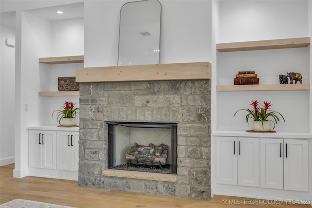 interior details with hardwood / wood-style floors and built in features