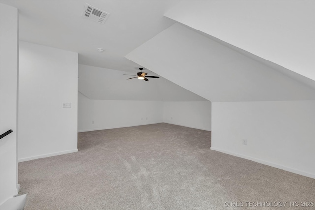 bonus room featuring lofted ceiling, light carpet, and ceiling fan