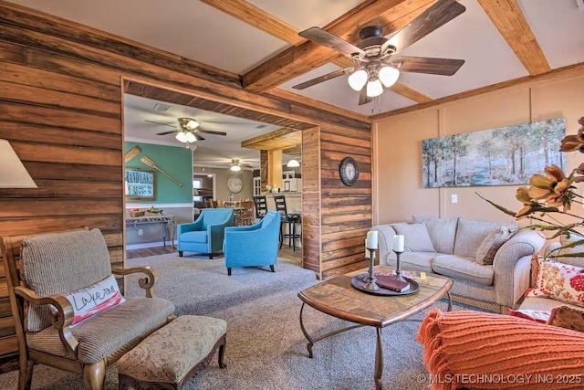 living room with carpet flooring and beam ceiling