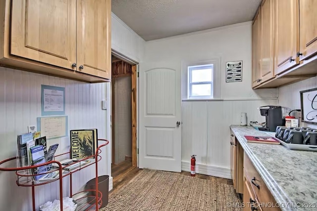 kitchen featuring light brown cabinetry and light hardwood / wood-style floors