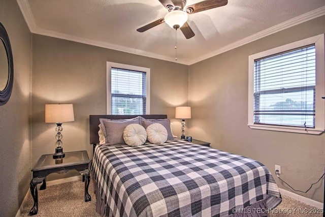 bedroom featuring ceiling fan, crown molding, a textured ceiling, and carpet