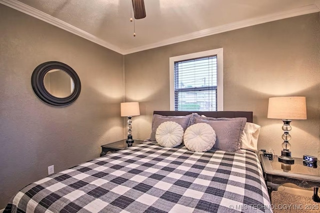 bedroom featuring ornamental molding and ceiling fan