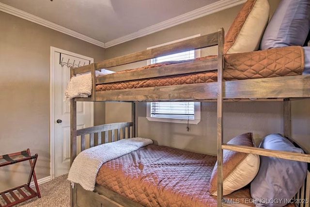 carpeted bedroom featuring crown molding