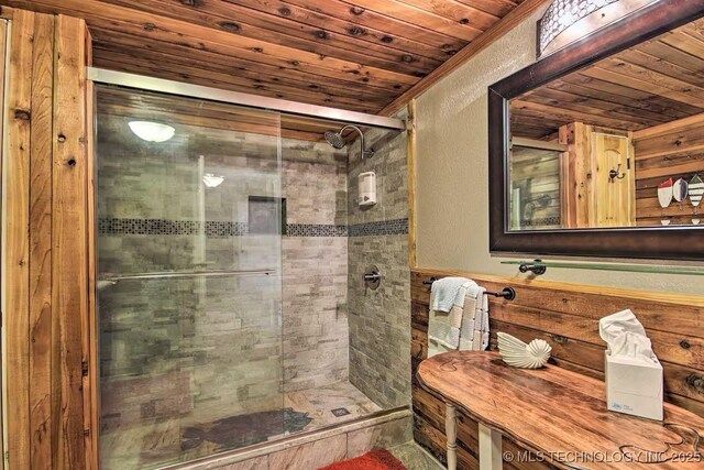 bathroom featuring wood ceiling and walk in shower