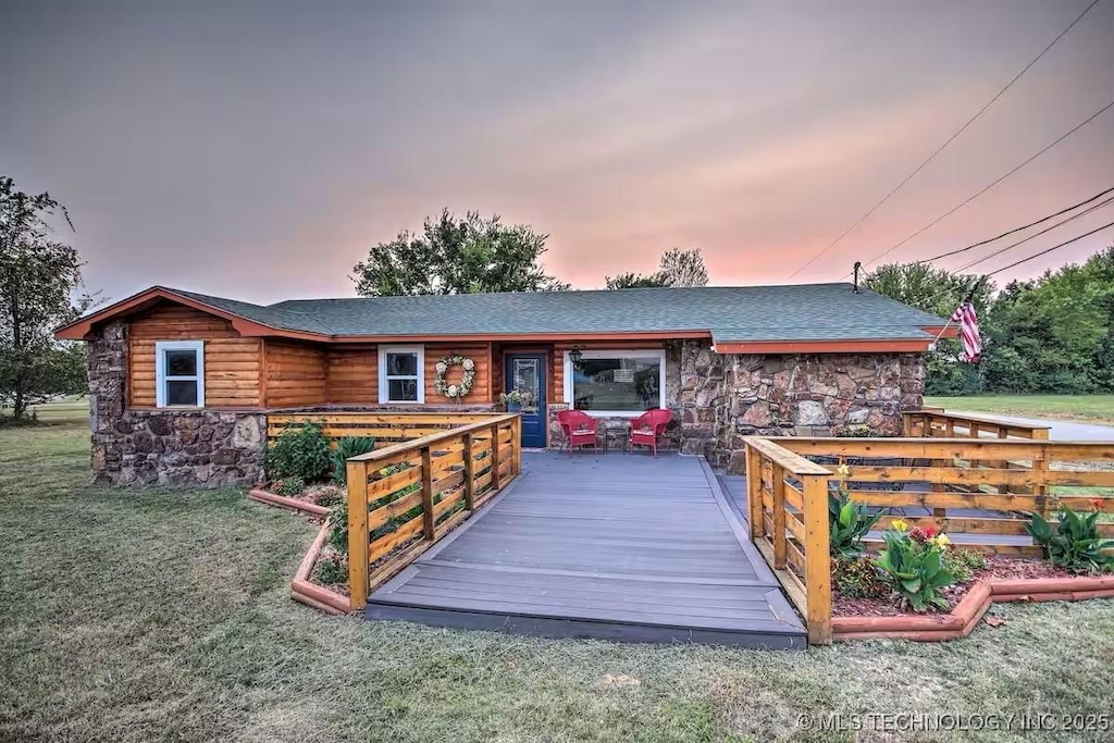 438 N 36th, Grove, OK 74344 - back house at dusk with a yard