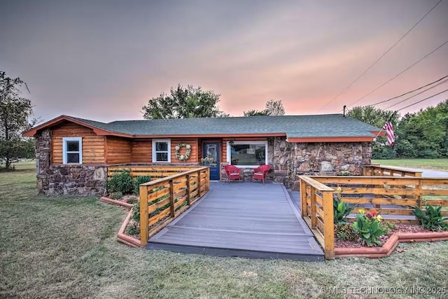 back house at dusk with a yard