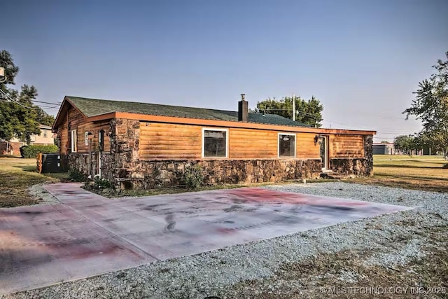 back of property featuring central air condition unit