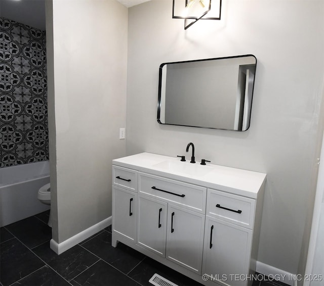 full bathroom with vanity, toilet, and washtub / shower combination