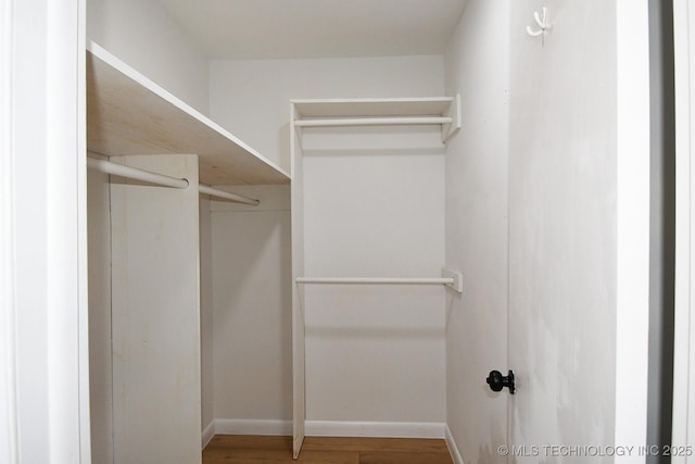 walk in closet featuring hardwood / wood-style floors