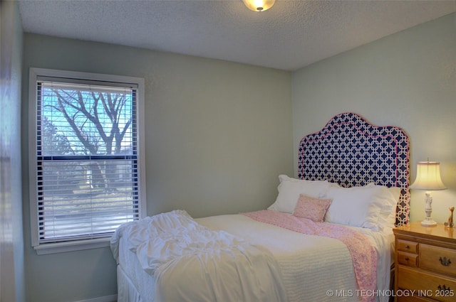 bedroom featuring a textured ceiling