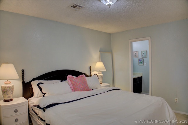 bedroom featuring a textured ceiling