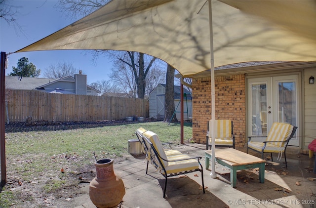 view of patio featuring french doors and a storage shed