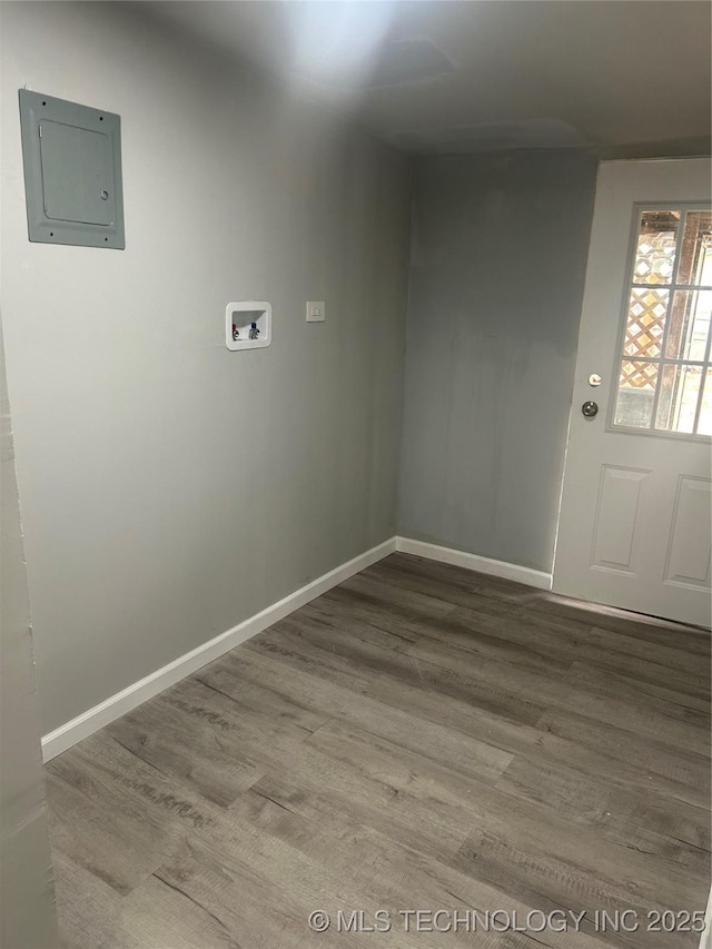 laundry room featuring wood-type flooring, electric panel, and hookup for a washing machine