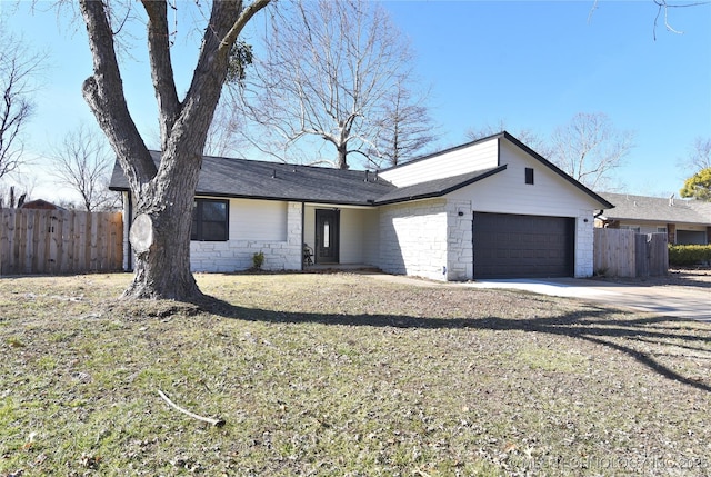 ranch-style house featuring a garage