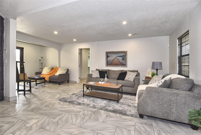 living room featuring a textured ceiling