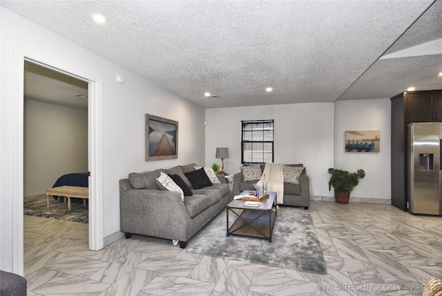 living room with a textured ceiling