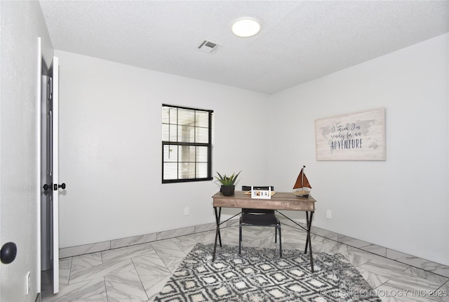 office area featuring a textured ceiling