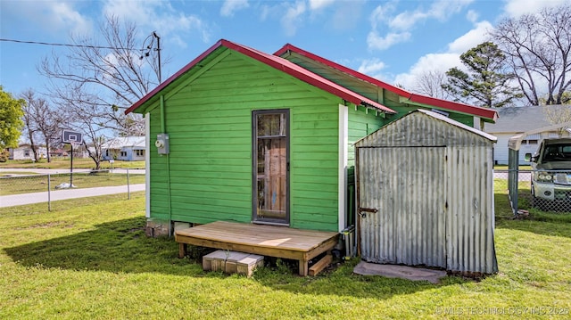 view of outdoor structure featuring a lawn