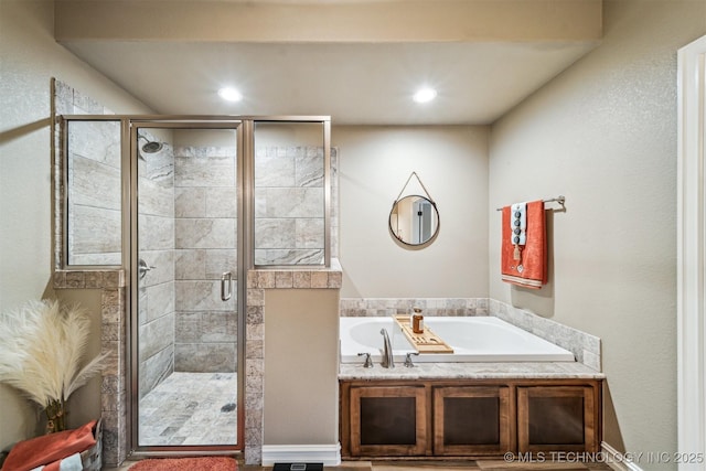 bathroom with shower with separate bathtub