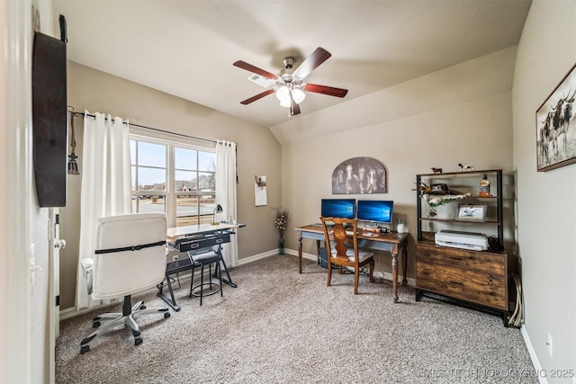 office space featuring ceiling fan, lofted ceiling, and carpet floors