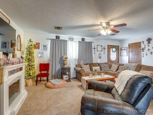 living room with light carpet, a textured ceiling, and ceiling fan