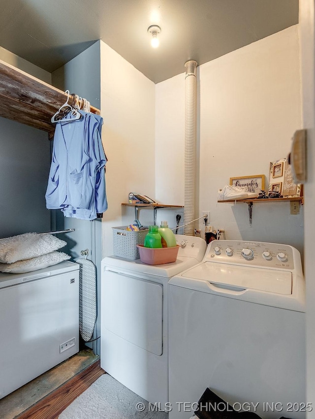 clothes washing area with independent washer and dryer