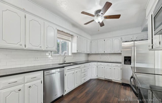 kitchen featuring sink, stainless steel appliances, and white cabinets