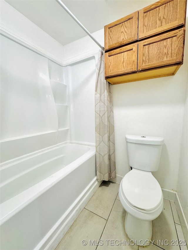 bathroom featuring shower / bath combo, tile patterned floors, and toilet