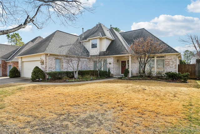 view of front of home featuring a garage and a front yard