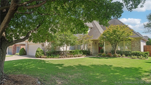 obstructed view of property with a front lawn