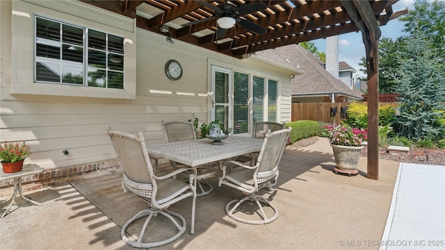 view of patio / terrace with ceiling fan and a pergola