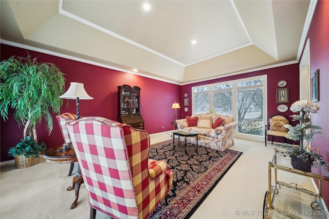 carpeted living room featuring crown molding and a raised ceiling