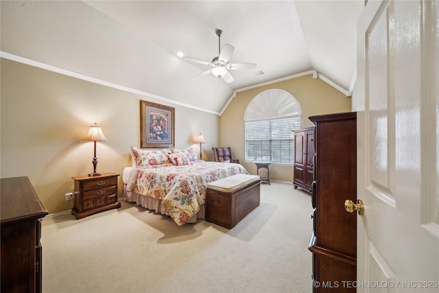 carpeted bedroom with vaulted ceiling, ornamental molding, and ceiling fan