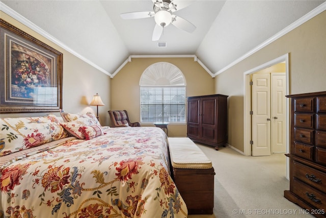 carpeted bedroom featuring ornamental molding, lofted ceiling, and ceiling fan